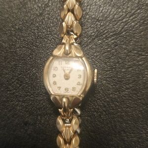 Gold Women's Watch with Leaf-Patterned Band